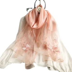 Pink embroidered silk wool scarf for women, elegant floral design main view display.