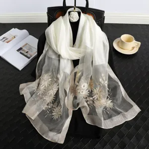 Elegant white silk scarf with delicate gold floral embroidery, perfect for spring and autumn.