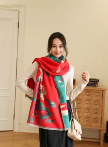 Detailed view of winter jacquard tassel scarf, red and green lotus design shawl.