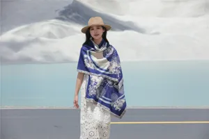 Detailed shot of winter blue patterned jacquard fringe imitation cashmere shawl scarf.