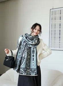 Close-up view of the elegant winter printed cashmere-feel scarf, soft texture and chic pattern.