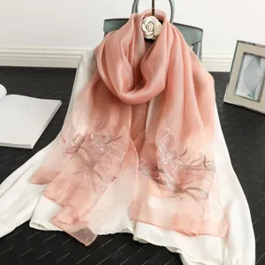 Pink silk scarf with exquisite floral embroidery and sparkling rhinestones for elegant women.