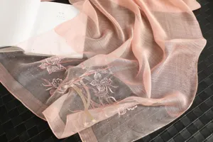 Pink silk scarf for women featuring delicate floral embroidery and sparkling crystal details.