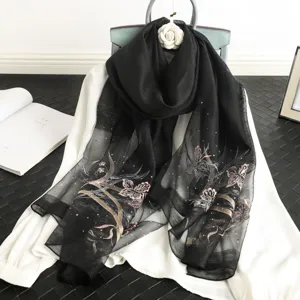 Elegant black silk blend shawl featuring exquisite floral embroidery and sparkling rhinestone details.