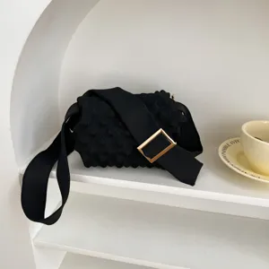 Black knitted crossbody bag with bubble texture and metal buckle for women casual daily wear.