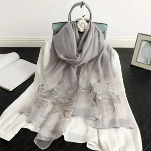 Grey silk scarf with delicate floral embroidery and rhinestone details for women elegance.