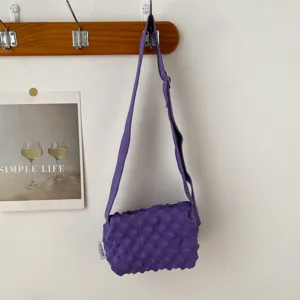 Purple knit bubble bag detail, textured shoulder crossbody bag showcasing unique soft fabric design.