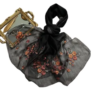 Elegant black silk embroidered scarf with copper floral details and shimmering trim for women.