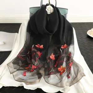 Black sheer silk wool embroidered scarf with vibrant floral red design, elegant shawl wrap.