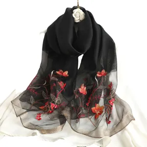 Black silk wool embroidered scarf with red lotus flowers and gold trim for elegant women daily.