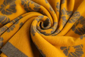 Detailed shot of the thick warm floral core-spun yarn scarf, showing soft texture and pattern.
