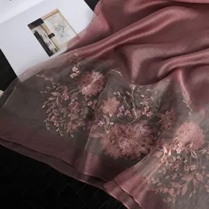 Detailed view of women's mulberry silk long scarf featuring elegant floral embroidery craftsmanship.