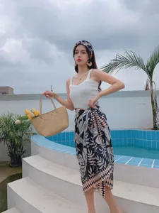 Detailed view of women summer printed scarf skirt outfit, casual fresh beach wear style.
