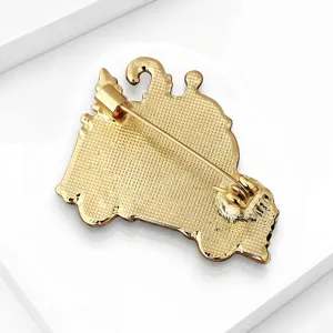 Gold-tone Christmas car brooch back detail, secure pin closure, elegant holiday accessory.