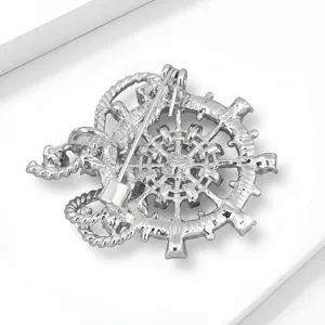 Close-up back view of silver alloy nautical ship wheel brooch pin showing sturdy fastening mechanism.