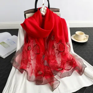 Red silk wool embroidered scarf women elegant floral sheer sun protection shawl detail view.