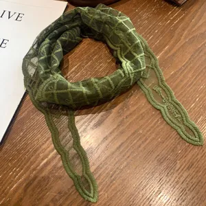 Green mesh lace scarf detail, stylish embroidered grid pattern, elegant summer neckwear accessory.