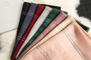 Silk wool striped scarf women elegant fashion shawl detail view showing colorful fabric texture.