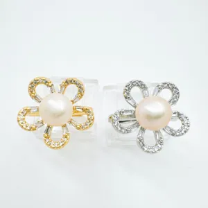 Close-up detail of exquisite pearl flower rings featuring sparkling zircon petals.
