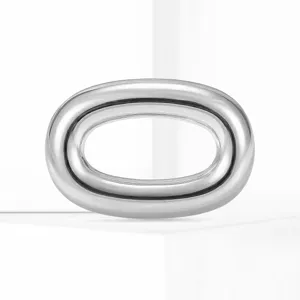 Stainless steel oval ring brooch detail shot, minimalist fashion accessory for suit and shirt.