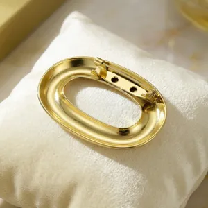 Gold stainless steel oval brooch pin elegant stylish suit coat accessory lapel jewelry item