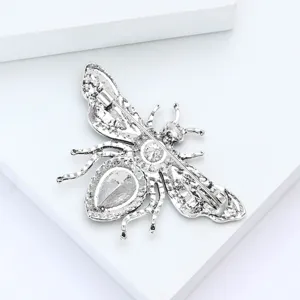 Detail view of the silver bee brooch back featuring a secure pin mechanism and alloy frame.