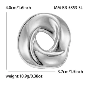 Stainless steel circular twisted brooch for men and women fashion clothing accessory.