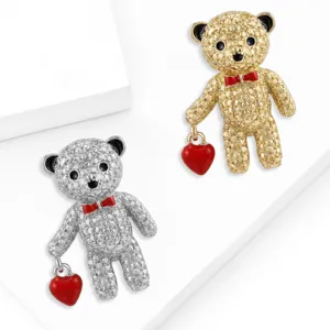 Rhinestone crystal teddy bear brooch pin with red heart bag, elegant alloy fashion jewelry detail view.