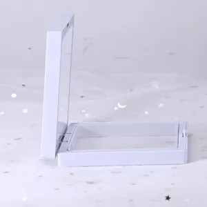 White floating display box detail shot, transparent film showcase for jewelry or small items.