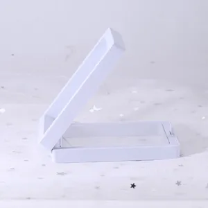 White floating jewelry display box detail, transparent film holder case for small items.