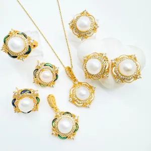 Luxury pearl jewelry set detail showing intricate gold micro-inlaid pendant, rings and earrings.