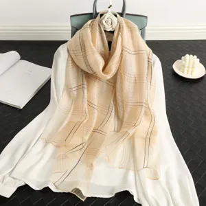 Elegant women's silk wool striped scarf with shimmering gold thread, lightweight autumn shawl.