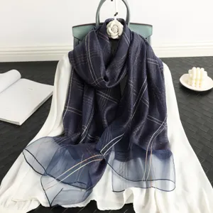 Women's luxury navy blue plaid silk wool scarf shawl elegant fashion accessory detail view.