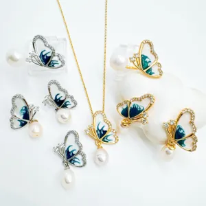 Elegant pearl butterfly jewelry set with necklace and earrings, gold plated crystal design.