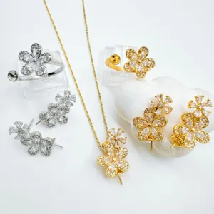 Gold and silver plated flower jewelry accessories set with necklace, earrings, and rings.