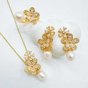Elegant pearl flower jewelry set with sparkling zircon, including necklace, ring and earrings.