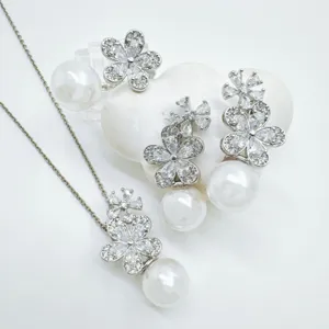 Elegant pearl flower jewelry set with sparkling cubic zirconia necklace and matching earrings.