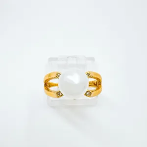 Gold-plated pearl ring with sparkling diamond accents, elegant fine jewelry detail view.
