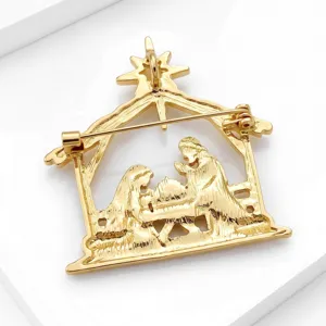 Gold tone metal nativity scene Christmas brooch, elegant religious lapel pin for suit coat.