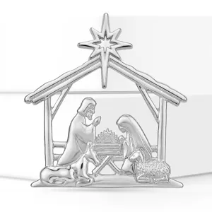 Detail view of a silver alloy religious nativity scene brooch, elegant holiday fashion accessory.