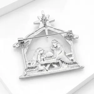 Detailed view of the silver-tone metal Christmas nativity scene brooch pin reverse side design.