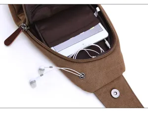 Men washed canvas chest bag detail showing internal compartment and headphone wire hole.