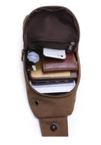 Detailed view of brown canvas chest bag, showing large capacity and internal compartments.
