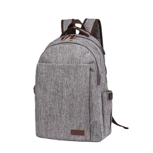 Water-resistant fabric backpack with USB port, stylish school bag for students and laptop.