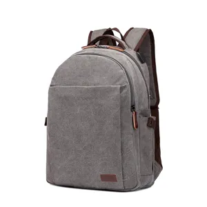 Grauer Canvas Rucksack für Damen und Herren, lässige Schultasche mit USB Ladeanschluss.