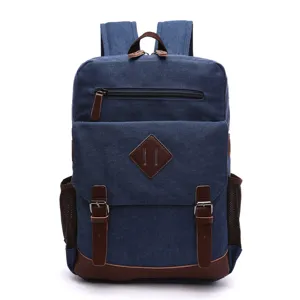 Zaino vintage in tela blu da uomo con finiture in pelle marrone, grande borsa per laptop e scuola.