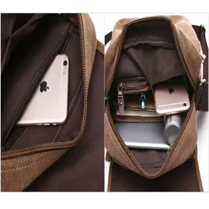 Detailed interior view showing multiple compartments and spacious capacity of the canvas bag.