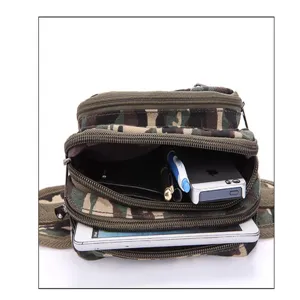 Detailed close-up view of multi-compartment canvas camo waist bag showing interior storage capacity.
