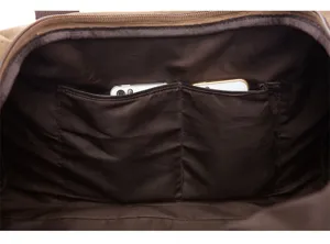 Canvas travel duffel bag interior detail showing inner double pocket storage space clearly.