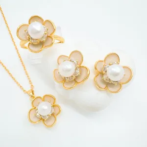 Charming camellia pendant earrings and ring set featuring lustrous freshwater pearl details.